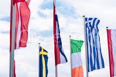 Europe countries flags against a blue sky