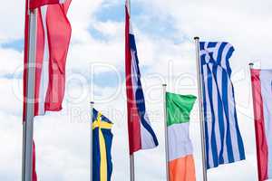 Europe countries flags against a blue sky