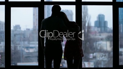 Silhouette of affectionate couple embracing