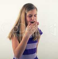 young girl yawning