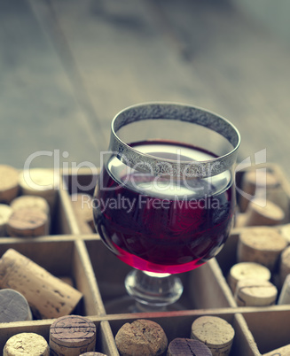 Glass of red wine, vintage color toned