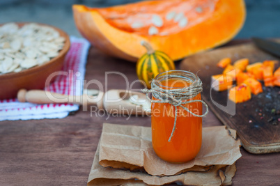 Fresh juice in a glass jar of pumpkin
