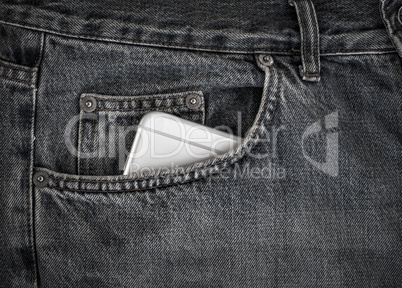 Smartphone in the front pocket of black jeans