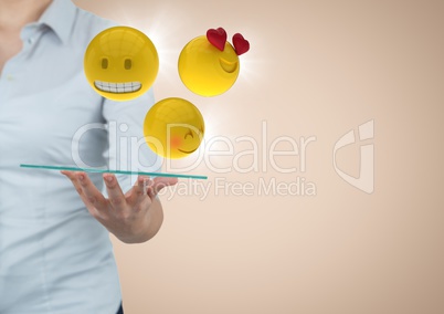 Business woman mid section with tablet and emojis and flares against cream background