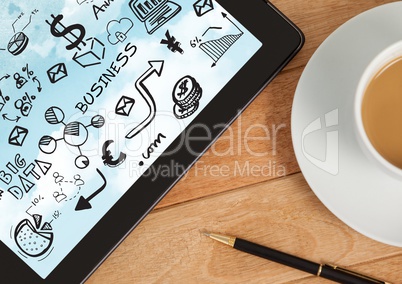 Tablet on desk with coffee showing black business doodles and sky