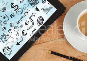 Tablet on desk with coffee showing black business doodles and sky