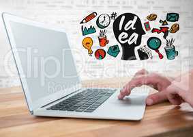 Hands with laptop and Idea text with drawings graphics