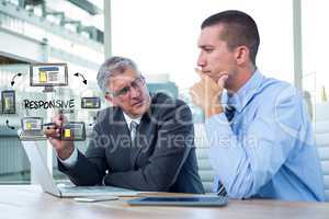 Digital composite image of executives with icons and laptop at desk