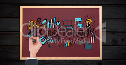 Woman drawing business icons on board