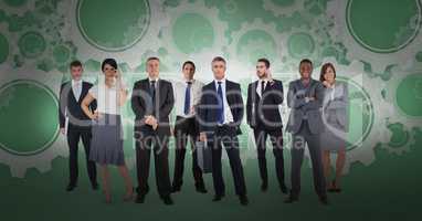 Digital composite image of business people with gear background