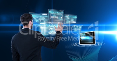 Digitally generated image of businessman touching futuristic screen