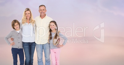 Portrait of smiling family standing at beach