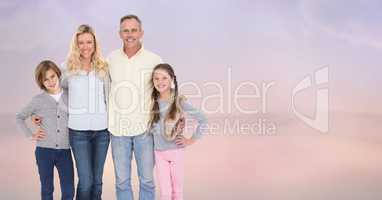 Portrait of smiling family standing at beach