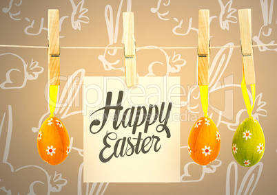 Happy Easter text with Easter Eggs on pegs with note in front of pattern