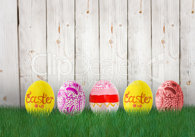 Easter yellow, orange and pink eggs in the garden