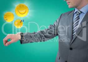Business man with hand out and emojis with flares against teal background