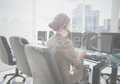 Customer service person at computers behind interface