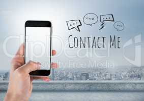 Hand holding phone and Contact Me text with drawings graphics