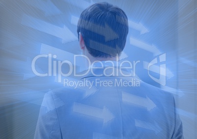 Back of business man with blue arrow graphic overlay
