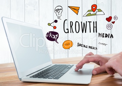 Hands on laptop with Growth social media text with drawings graphics
