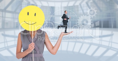 Digital composite image of businesswoman holding smiley while businessman running on her hand