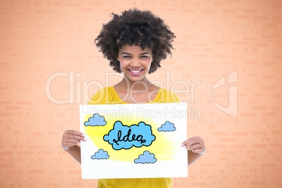 Portrait of smiling woman holding drawing of clouds representing ideas