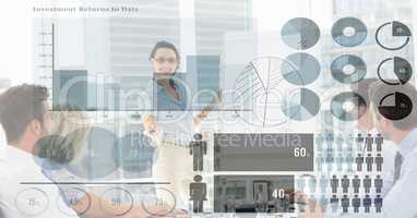 Digital composite image of business people and graphs
