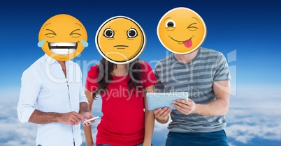 Digitally generated image of friends faces covered with emoji using digital tablet and smart phone a