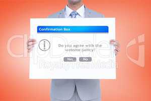 Digital composite image of businessman holding confirmation box