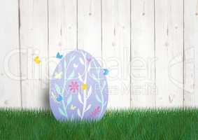 Purple egg with butterfly in the garden. happy Easter