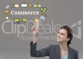 Businesswoman touching Commerce text with drawings graphics