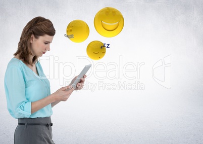 Woman with tablet and emojis with flare against white wall