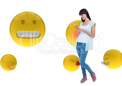 Happy girl sending messages with the phone on emoji background