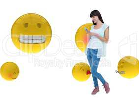 Happy girl sending messages with the phone on emoji background