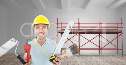 Builder with a lot of tools in font of 3D scaffolding