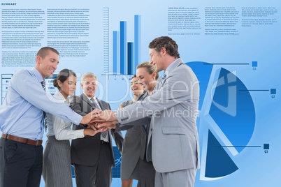 Business people stacking hands against graphs