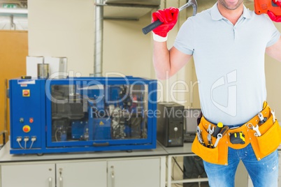 Midsection of handyman with tools