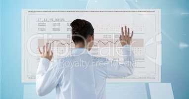 Digital composite image of doctor checking medical report