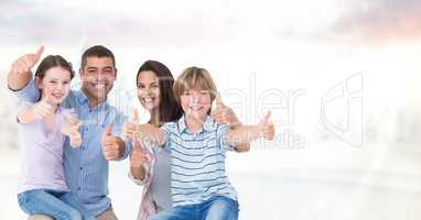 Portrait of happy family against sky