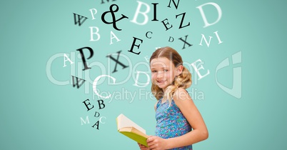 Happy girl holding book while letters flying in background