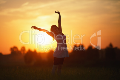 Woman on sunset background