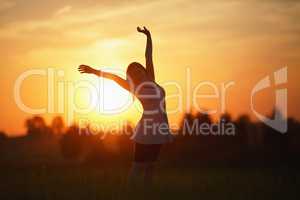 Woman on sunset background
