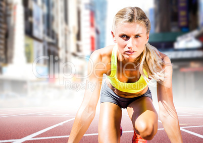 Woman runner on track in blurry city