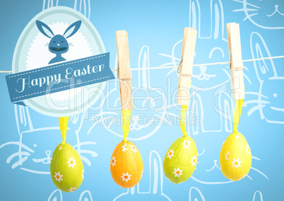 Happy Easter text with Easter Eggs on pegs in front of pattern