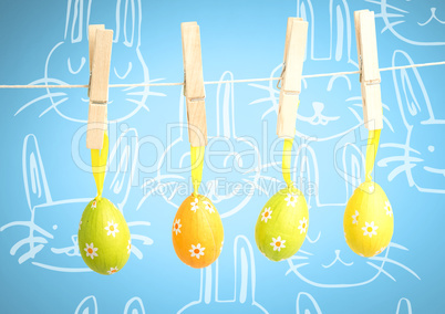 Easter Eggs on pegs in front of pattern