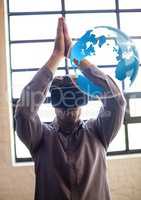 Man wearing VR Virtual Reality Headset with Interface of World praying meditating