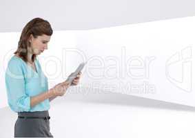 Woman with tablet against bright futuristic background