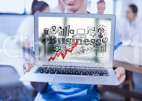 Woman holding laptop showing red arrow with black business doodles against blurry background