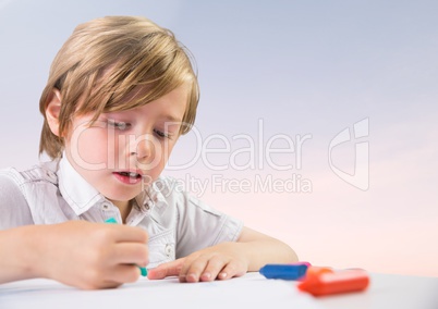 Young boy coloring with soft bright background