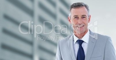 Businessman with office buildings